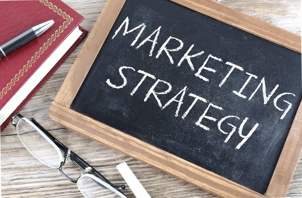"Marketing Strategy" written on a small chalkboard.